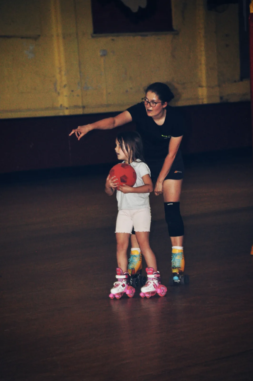 A young skater being helped during Skate Fit